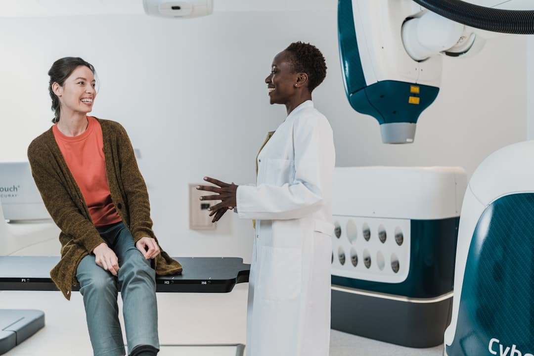 a man and a woman talking. Cover image for: AI Medical Scribe for Gastroenterology.