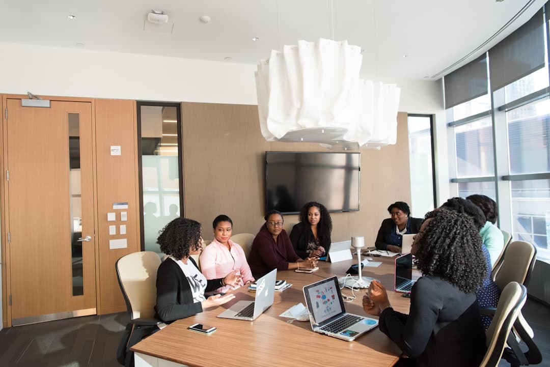 photography of people inside room during daytime. Cover image for: Voice Recognition vs AI Scribe: Why Dictation Software Isn't Enough.