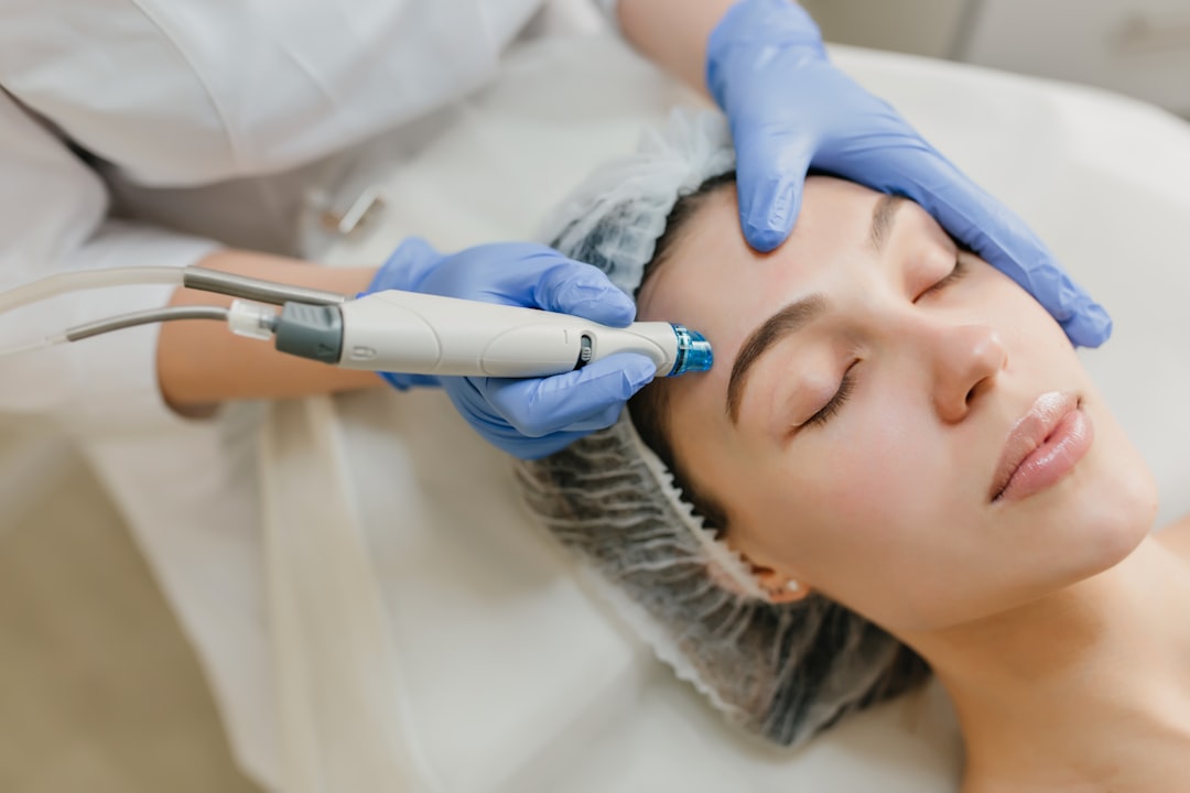 a woman getting a facial peel from a doctor. Cover image for: AI Scribe in Dermatology and Procedure-Heavy Specialties.