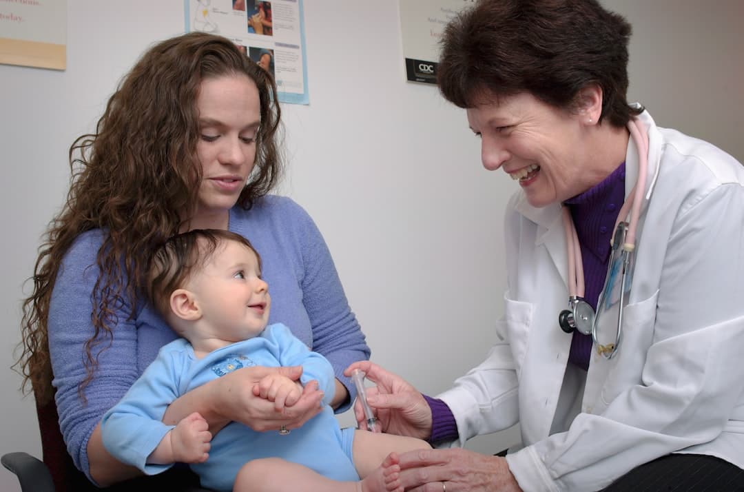 a young child is being examined by a doctor. Cover image for: AI Medical Scribe for Pediatrics.